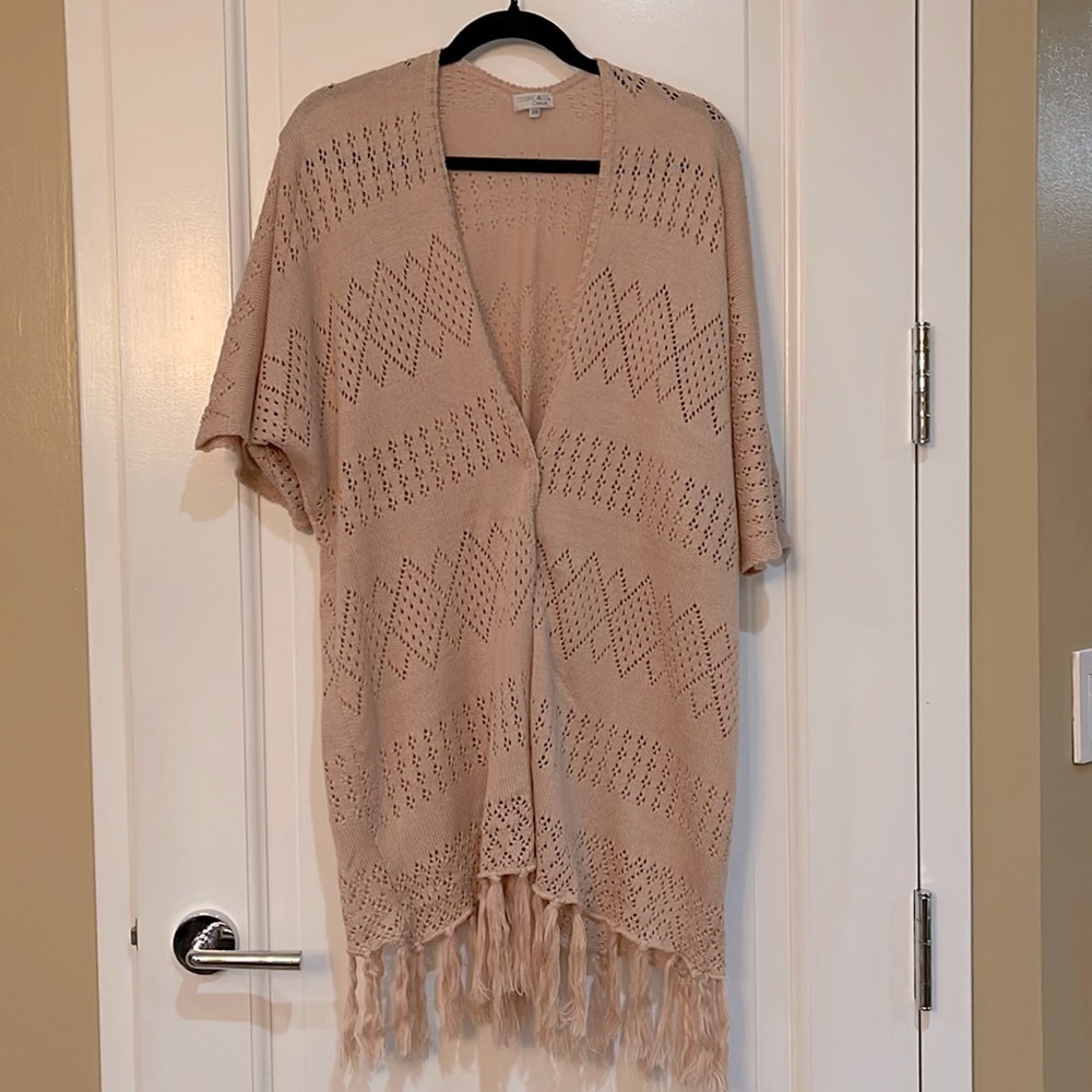 Knitted poncho-like sweater